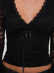 back view of model wearing Princess Polly Temptation Incoming Long Sleeve Lace Top Black Full Sleeves V-Neck 