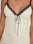 Mini dress V neckline, adjustable straps, lace trim detail at bust, lettuce edge hem Good stretch, fully lined 