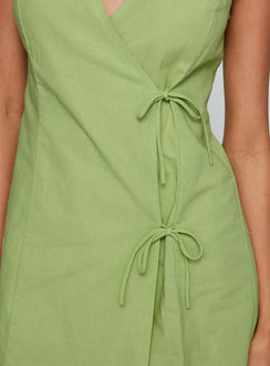 back view of model wearing Princess Polly Kodee Mini Dress Sage V-Neck 