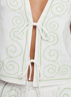 back view of model wearing Princess Polly Kindred Tie Top White / Green Sleeveless Plunger 