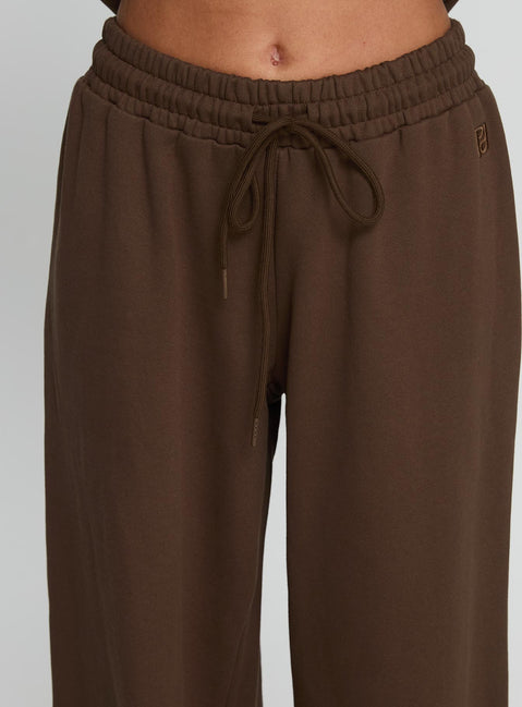 side view of model wearing Princess Polly All Day Straight Leg Sweatpants Chocolate Brown High Rise Pants 