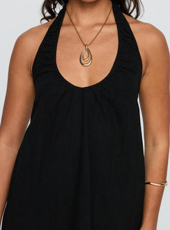 side view of model wearing Princess Polly Daydreams Linen Blend Halter Mini Dress Black Scoop Neck 