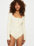 side view of model wearing Princess Polly Zuma Long Sleeve Bodysuit Beige Full Sleeves Scoop Neck 