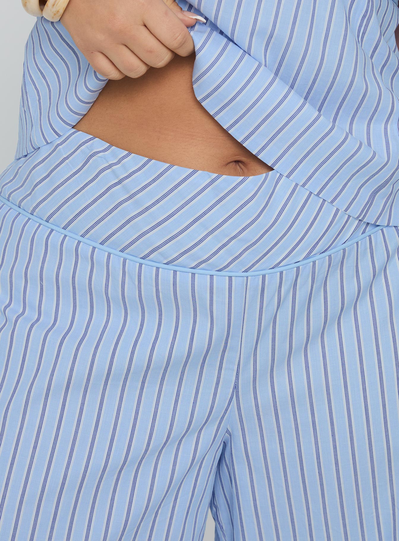 side view of model wearing Princess Polly Sofea Mid Rise Pant Blue Stripe Curve High Waisted Pants 