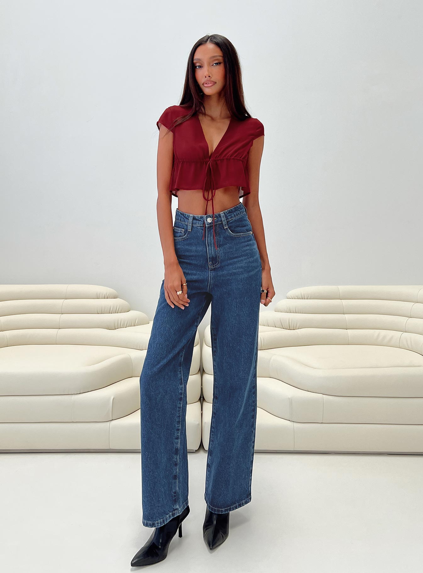 Front view of model wearing  front Princess Polly High Waisted  Nicolo Jeans Mid Blue Denim