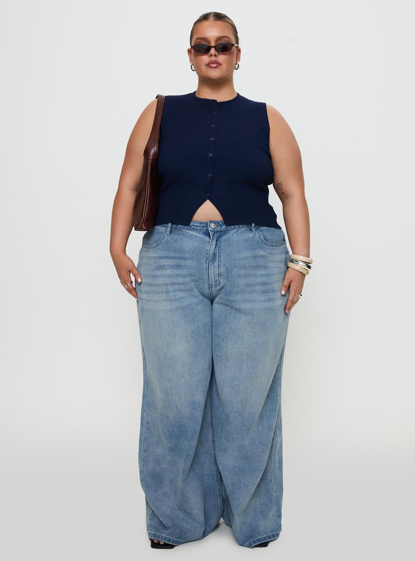 side view of model wearing Princess Polly Suzu Sleeveless Top Navy Curve Sleeveless Crew Neck 