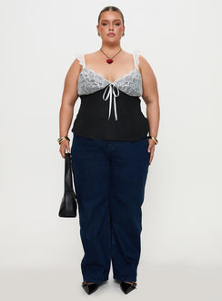 front view of model wearing Princess Polly Delvonte Top Black Curve Sleeveless Plunger 