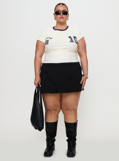 side view of model wearing Princess Polly Track Record Graphic Top Cream Curve Short Sleeves Crew Neck 