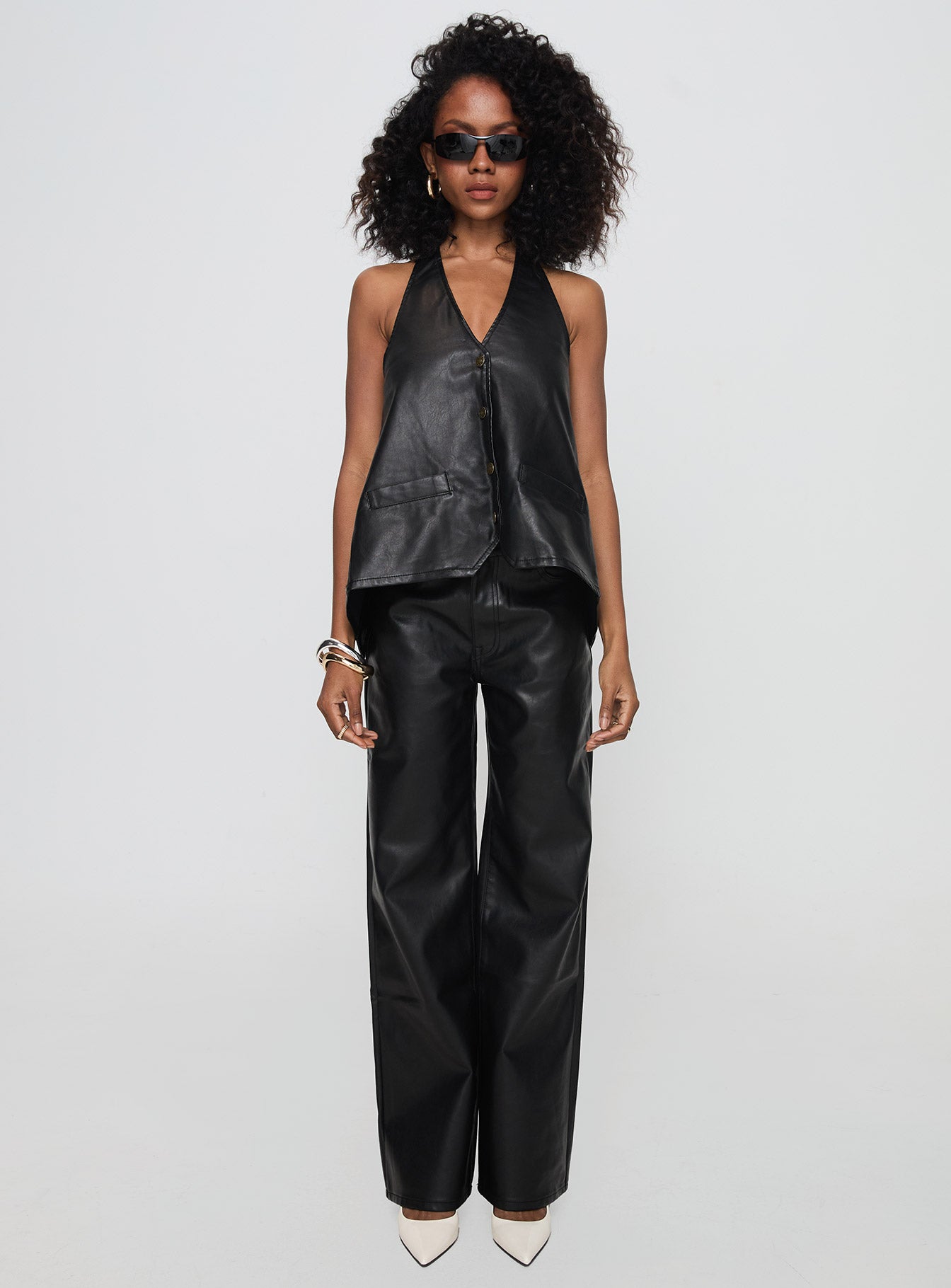 side view of model wearing Princess Polly Hills Halter Onyx Sleeveless V-Neck 