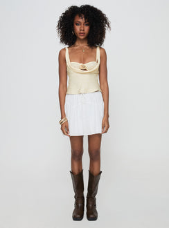   side view of model wearing Princess Polly Cherry On Top Mini Skirt White Mini Skirts 