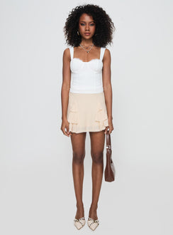 side view of model wearing Princess Polly Hazeel Top White Sleeveless Sweetheart 