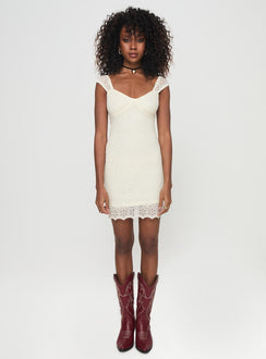 side view of model wearing Princess Polly Quillon Mini Dress Cream Sweetheart Neckline 