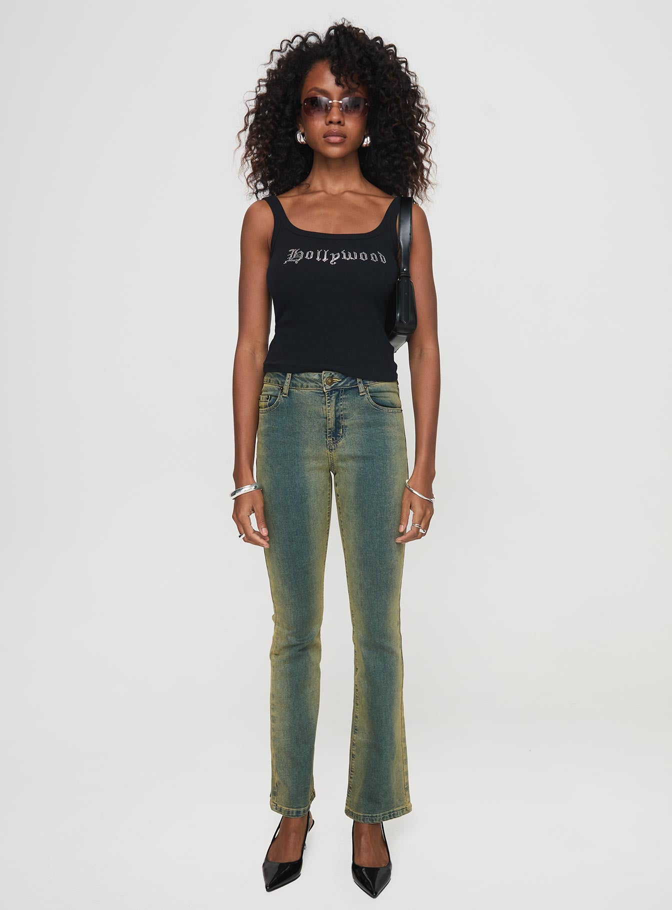 front view of model wearing Princess Polly Sandman Flare Jeans Antique Wash Mid Rise 