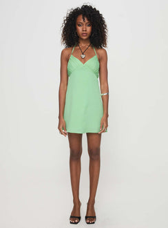 side view of model wearing Princess Polly Marciela Mini Dress Green V-Neck 
