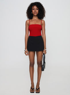 side view of model wearing Princess Polly Lilani Bodysuit Red Sleeveless Square Neck 