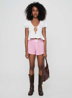 side view of model wearing Princess Polly Back To It Boxer Shorts Pink Gingham High Waisted Shorts 