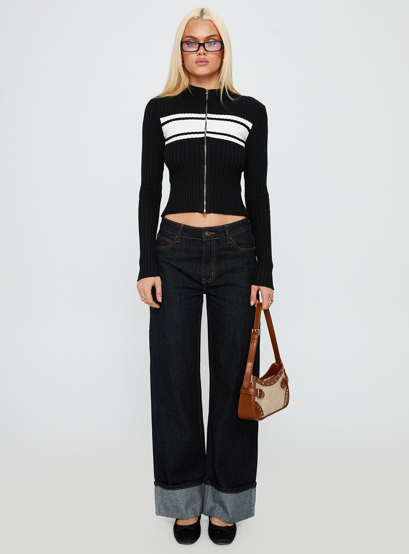 side view of model wearing Princess Polly Decisive Zip Through Knit Sweater Black / White cropped 