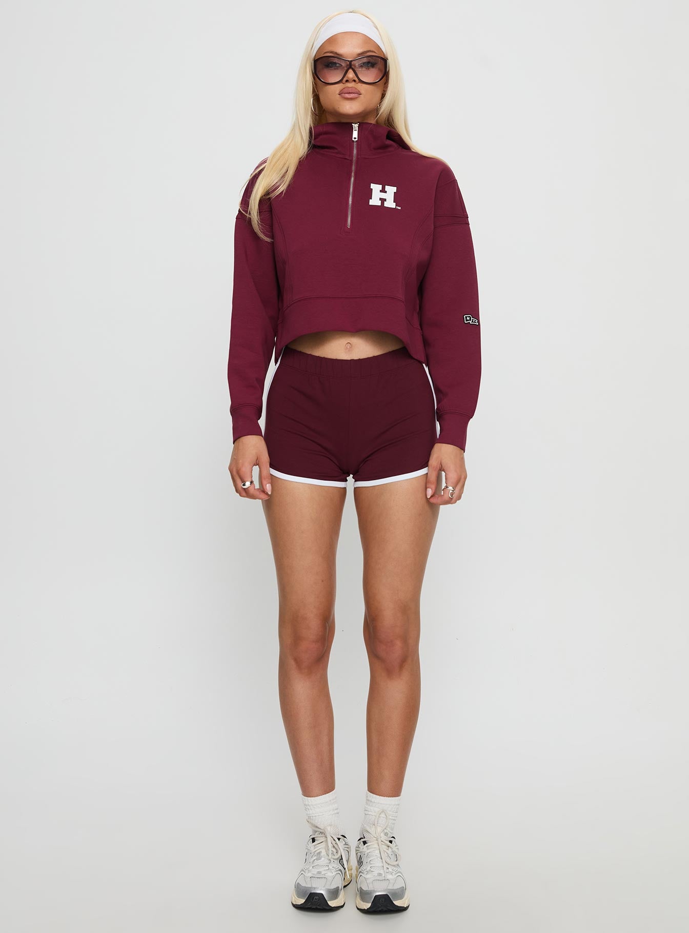 side view of model wearing Princess Polly Harvard Buttersport Half-zip Hoodie Crimson cropped 