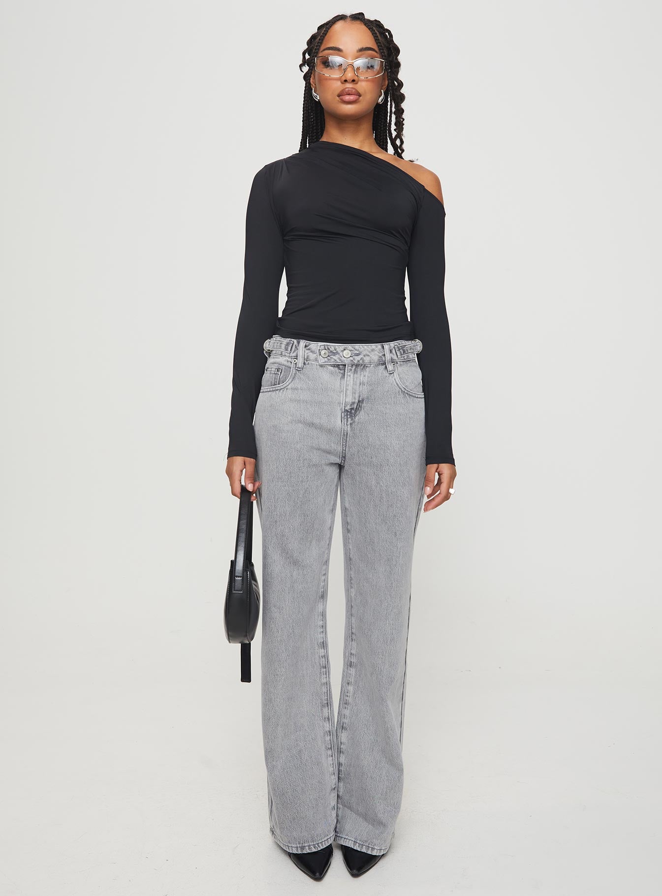 front view of model wearing Princess Polly Lasharie Long Sleeve Top Black Full Sleeves Asymmetric Neckline 