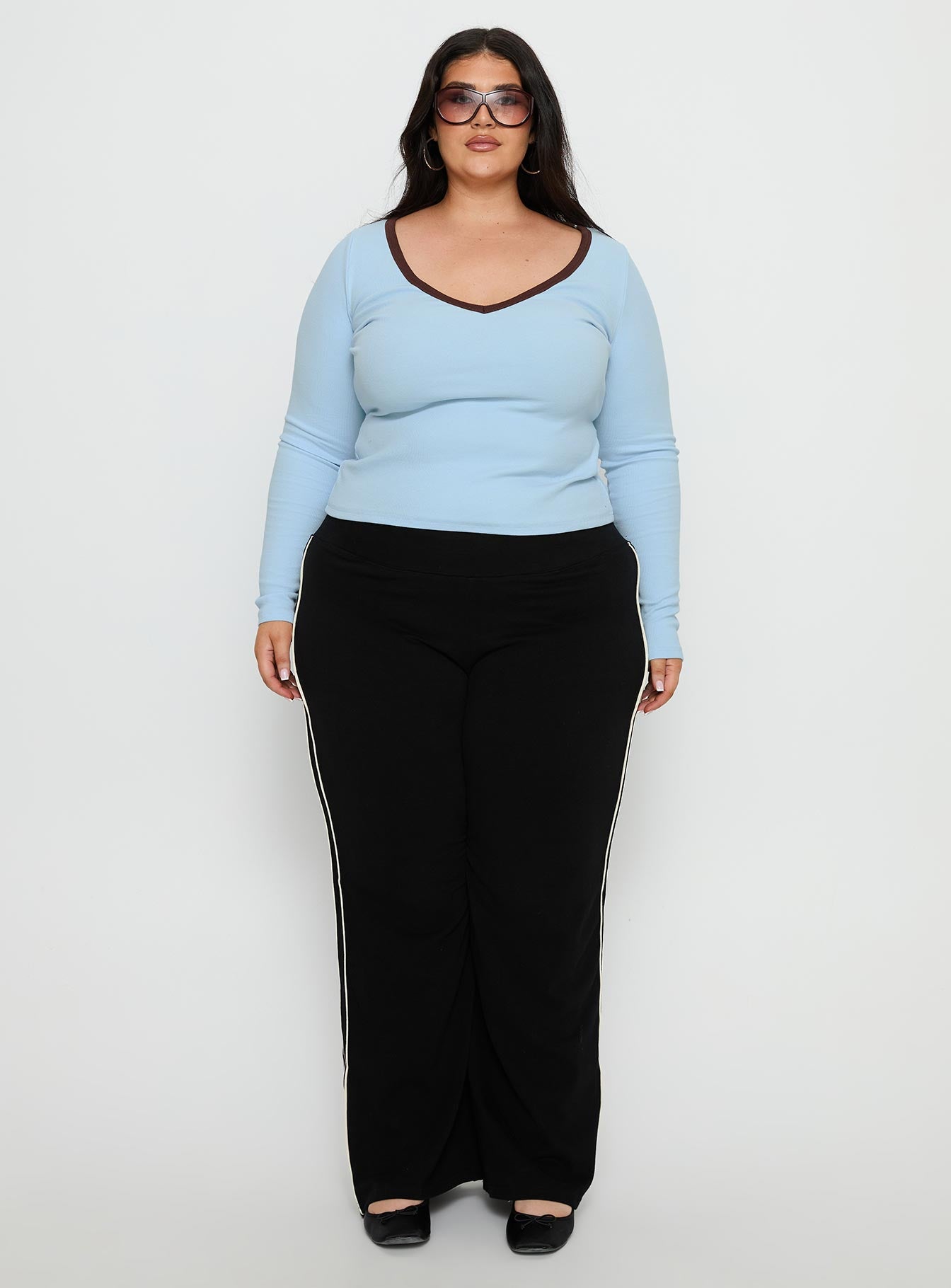 front view of model wearing Princess Polly Ascenda Straight Leg Track Pant Black Curve Mid Rise Pants 