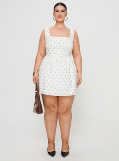 side view of model wearing Princess Polly Samana Mini Dress White Curve Square Neck 