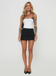 front view of model wearing Princess Polly Vickee Top White / Black Sleeveless Scoop Neck 