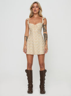 front view of model wearing Princess Polly Landon Mini Dress Yellow Floral Petite Scoop Neck 