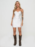 side view of model wearing Princess Polly Snowbird Mini Dress White / Floral Sweetheart Neckline 