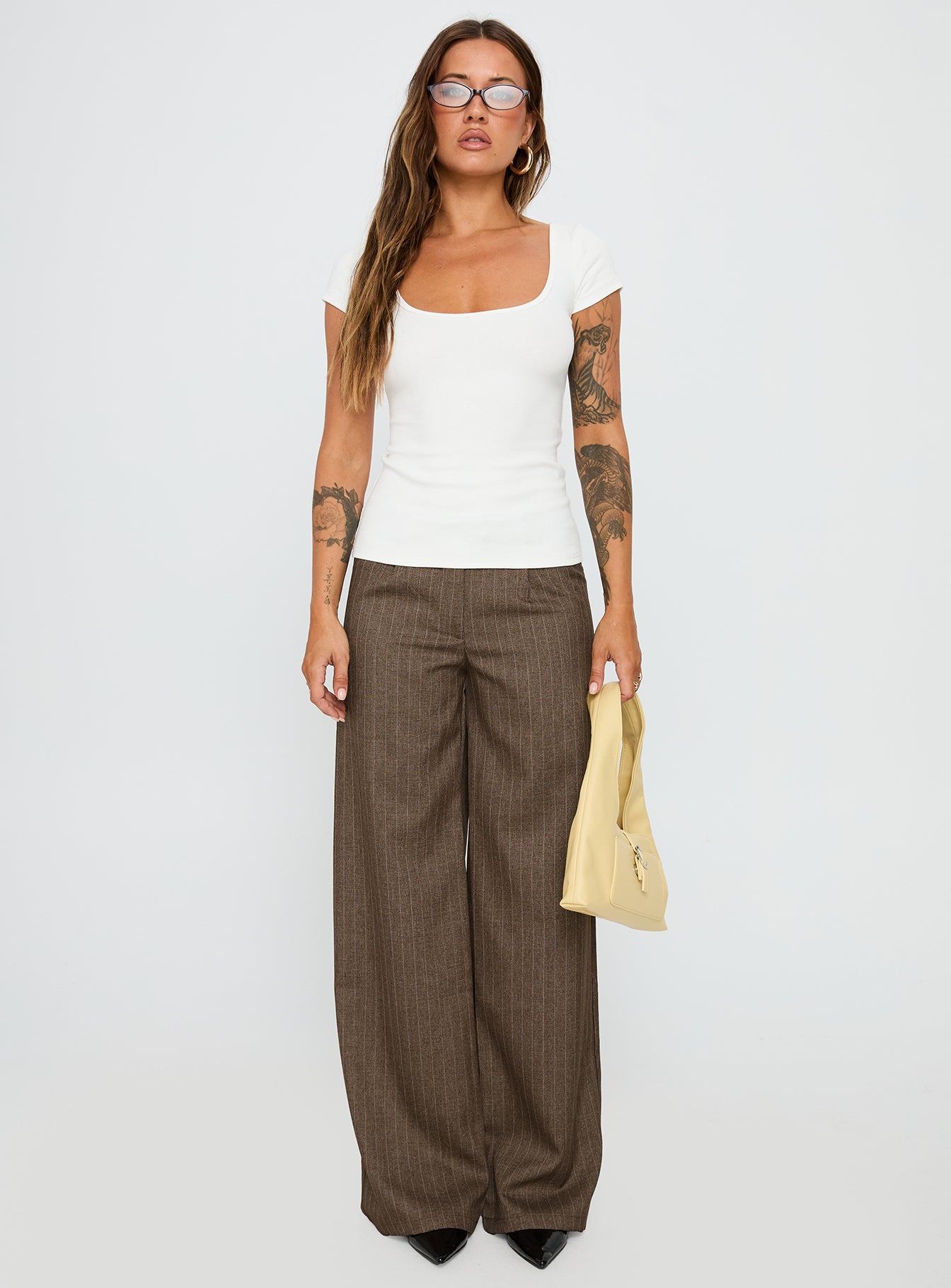 front view of model wearing Princess Polly Broadcast Pants Beige Pinstripe Low Rise Pants 