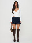   side view of model wearing Princess Polly Ryver Denim Wrap Skort Dark Wash Mini Skirts 