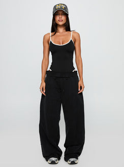 side view of model wearing Princess Polly That Effect Bodysuit Black Sleeveless 