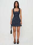 side view of model wearing Princess Polly Dasha Mini Dress Navy Floral Square Neck 