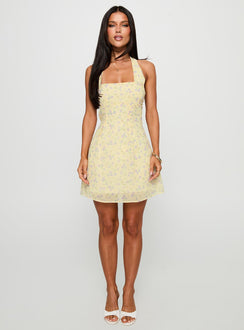 front view of model wearing Princess Polly Rosamie Halter Mini Dress Cream / Floral Square Neck 