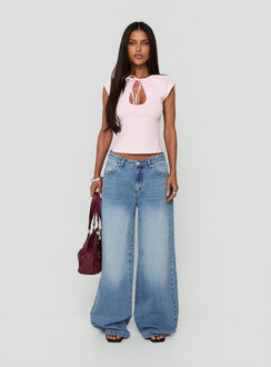 Showcasing Lokura Low Rise Super Baggy Jeans Vintage Mid Blue Wash womens-jeans front view of model wearing Princess Polly