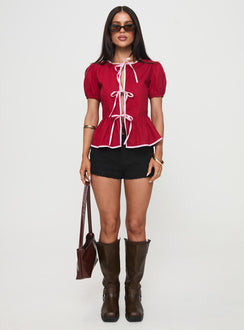 side view of model wearing Princess Polly Ryota Blouse Red/pink Short Sleeves Crew Neck 