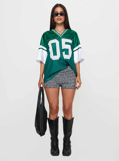 front view of model wearing Princess Polly Kronwall Sports Jersey Top Green / White Three Fourth Sleeves V-Neck 