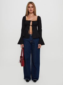 side view of model wearing Princess Polly Lilibette Tie Up Long Sleeve Top Black Full Sleeves Square Neck 