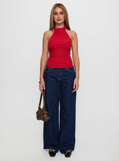 side view of model wearing Princess Polly Merril Halter Top Red Sleeveless High Neck 