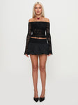 front view of model wearing Princess Polly French Exit Bubble Hem Skort Black High Waisted Shorts 