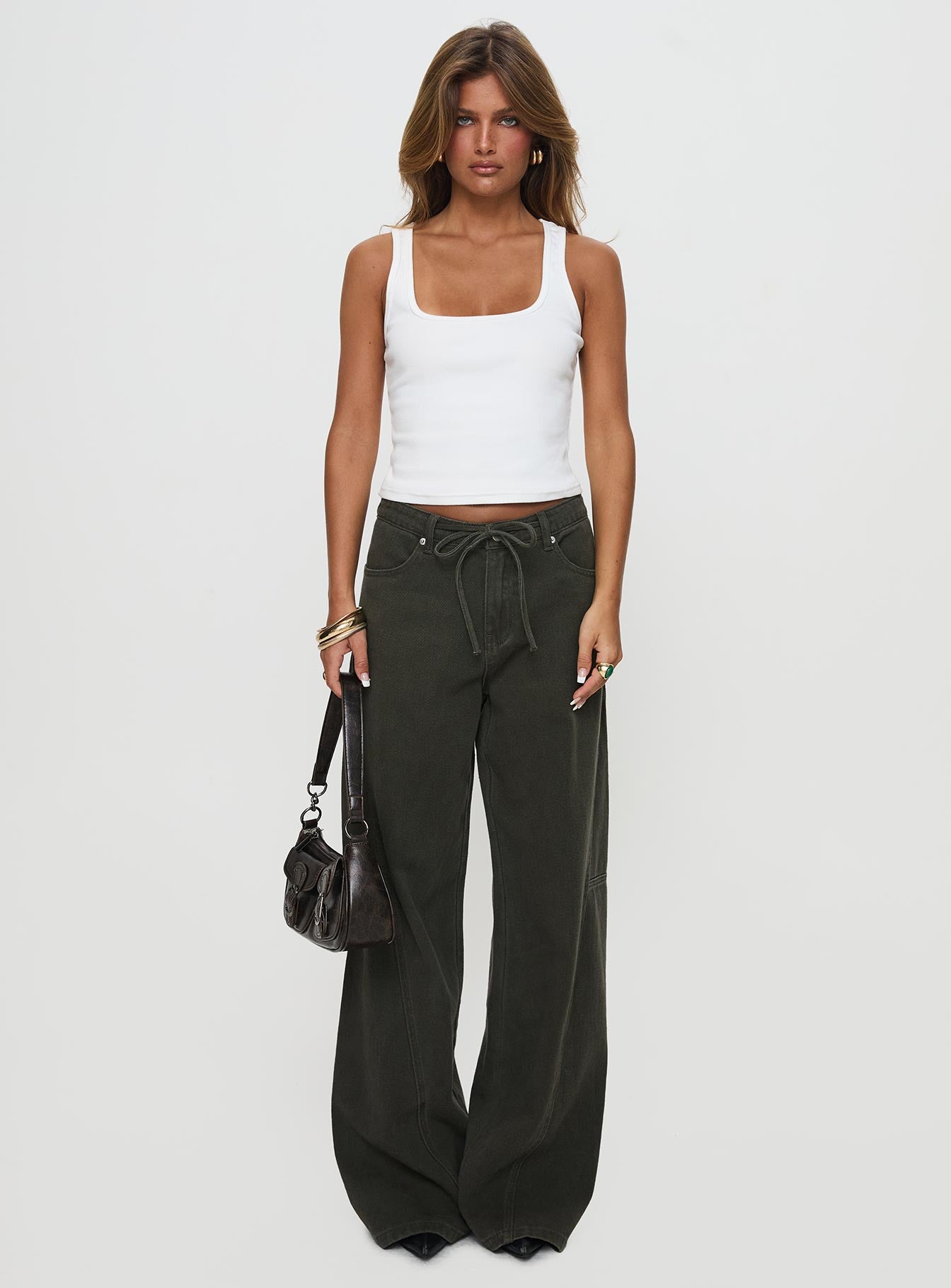 front view of model wearing Princess Polly Bruiser Tie Waist Mid Rise Wide Leg Jeans Green High Rise Jeans 