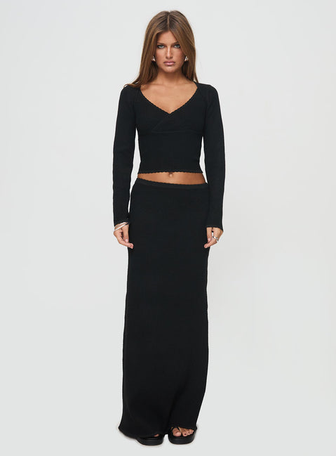 side view of model wearing Princess Polly Memi Long Sleeve Top Black Full Sleeves V-Neck 