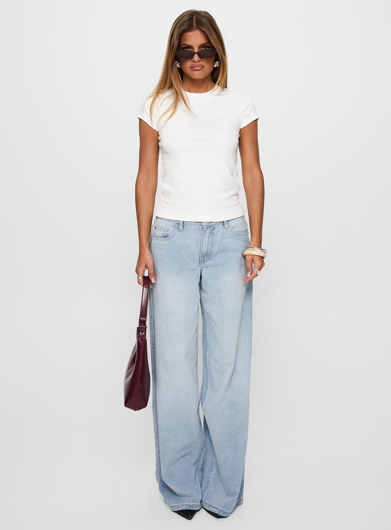 side view of model wearing Princess Polly Prestige Longline Baby Tee Ivory Short Sleeves Crew Neck 