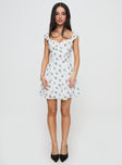 side view of model wearing Princess Polly True Lives Mini Dress White Floral Sweetheart Neckline 