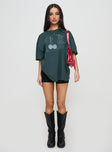 side view of model wearing Princess Polly Sour Cherry Oversized Tee Moss Green Half Sleeves Crew Neck 