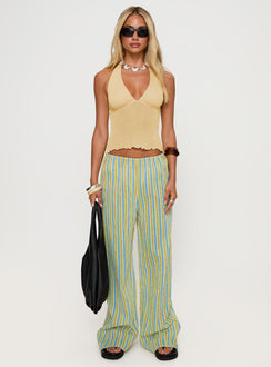 side view of model wearing Princess Polly Leam Top Butter Sleeveless Plunger 