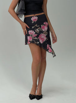 back view of model wearing Princess Polly Apricota Mini Skirt Black Floral Mini Skirts 