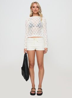 side view of model wearing Princess Polly Maddalyn Crochet Top White Full Sleeves Boat Neck 