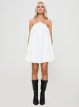 front view of model wearing Princess Polly Peaco Halter Mini Dress White Asymmetric Neckline 