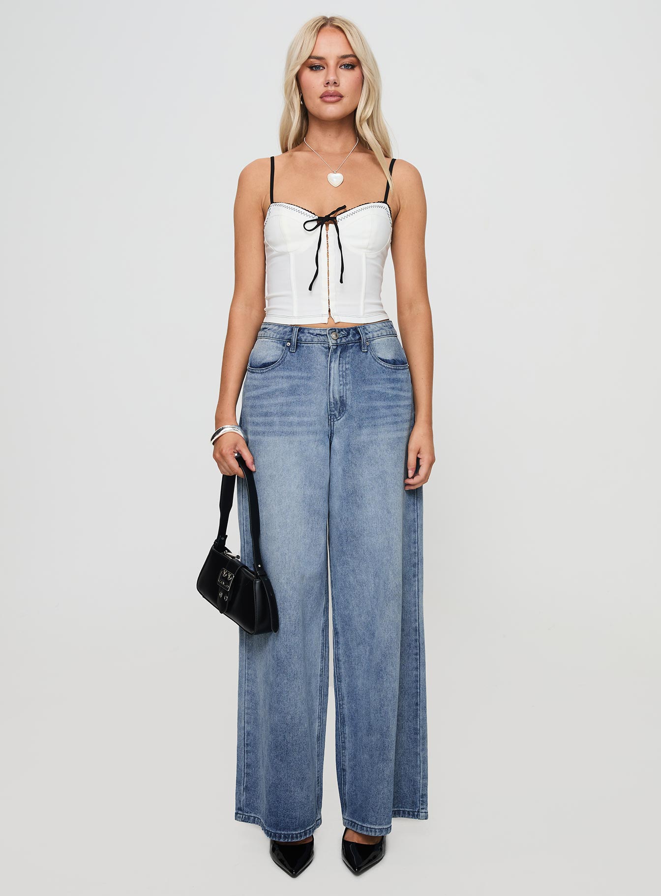 front view of model wearing Princess Polly Severas Top White Sleeveless Sweetheart 