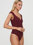 side view of model wearing Princess Polly Zenon Bodysuit Wine Sleeveless 